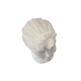 White knitted headband on a mannequin head against a white background