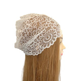 Lace headband on a mannequin head with long blonde hair against a white background