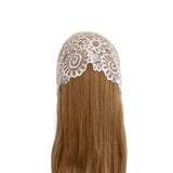 Brown hair extension with white lace top on a white background