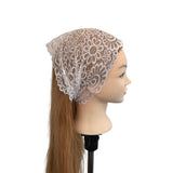 Mannequin head with a lace bonnet on a white background