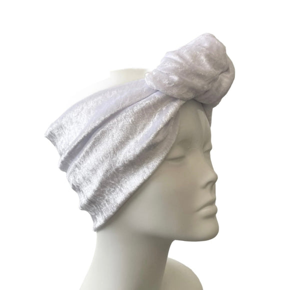 White headband on a mannequin head against a white background