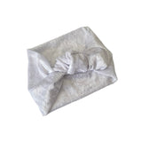 white headband with a knot on a white background