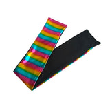 A pair of stretchy arm warmers shown on a white background, featuring a vibrant rainbow tie-dye pattern on one side and a solid black fabric on the other.