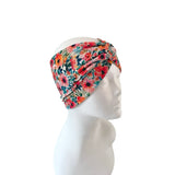Floral headband on a mannequin head against a white background