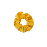 Yellow scrunchie on a white background