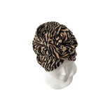 Zebra print headscarf on a mannequin head against a white background