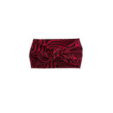 A red and black wavy patterned knotted headband, centered on a plain white background.